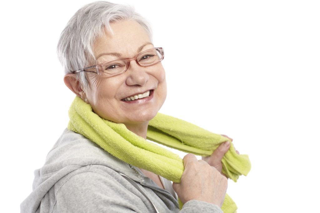Energetic woman smiling after workout